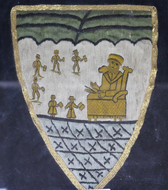 A 19th century silkwork armorial for Uppingham School, a similar painted zinc armorial by Webb of Oxford and